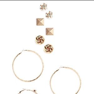 Gold set of stud and hoop earrings